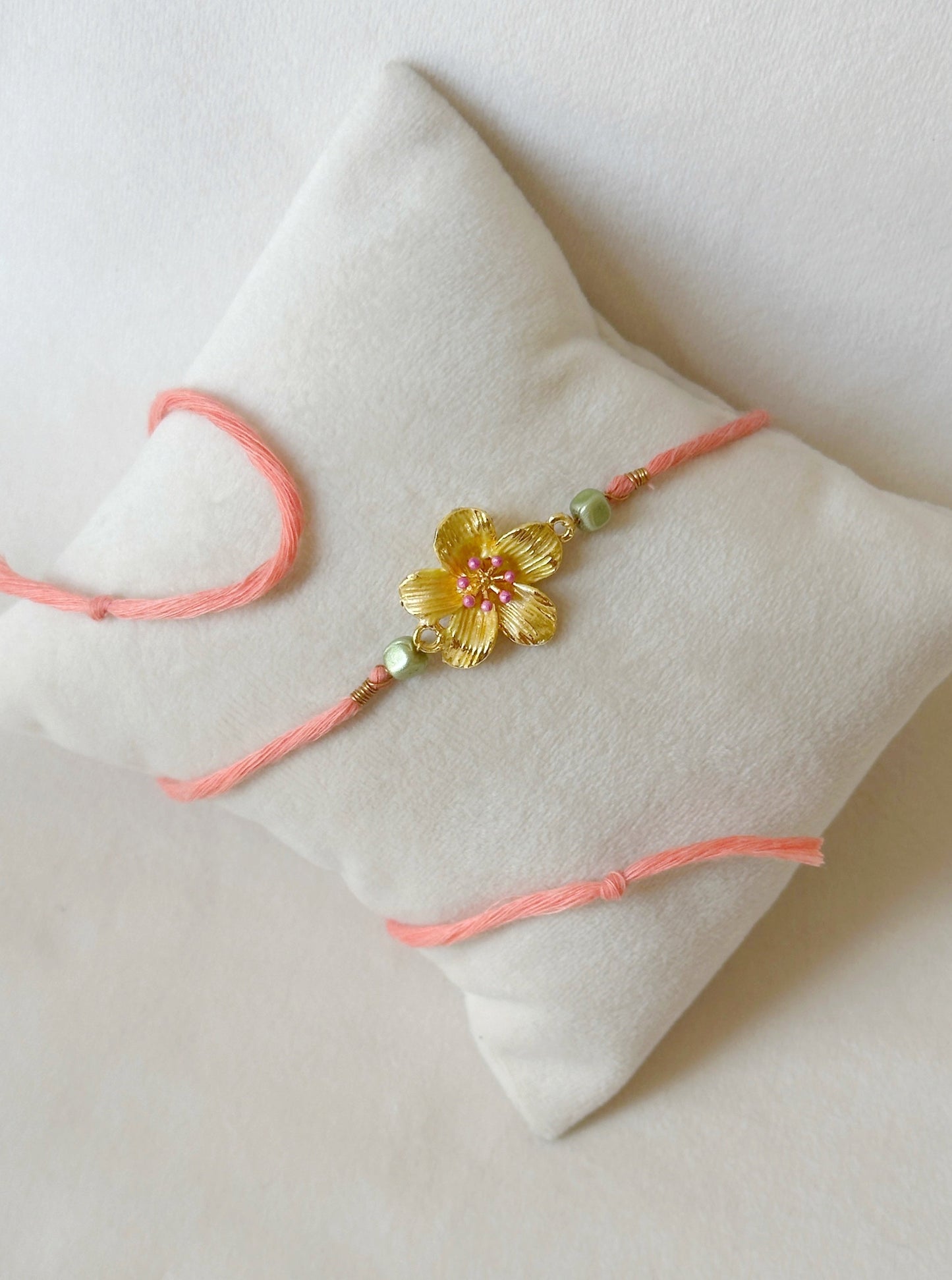 Floral Rakhi Small Gold, green and pink