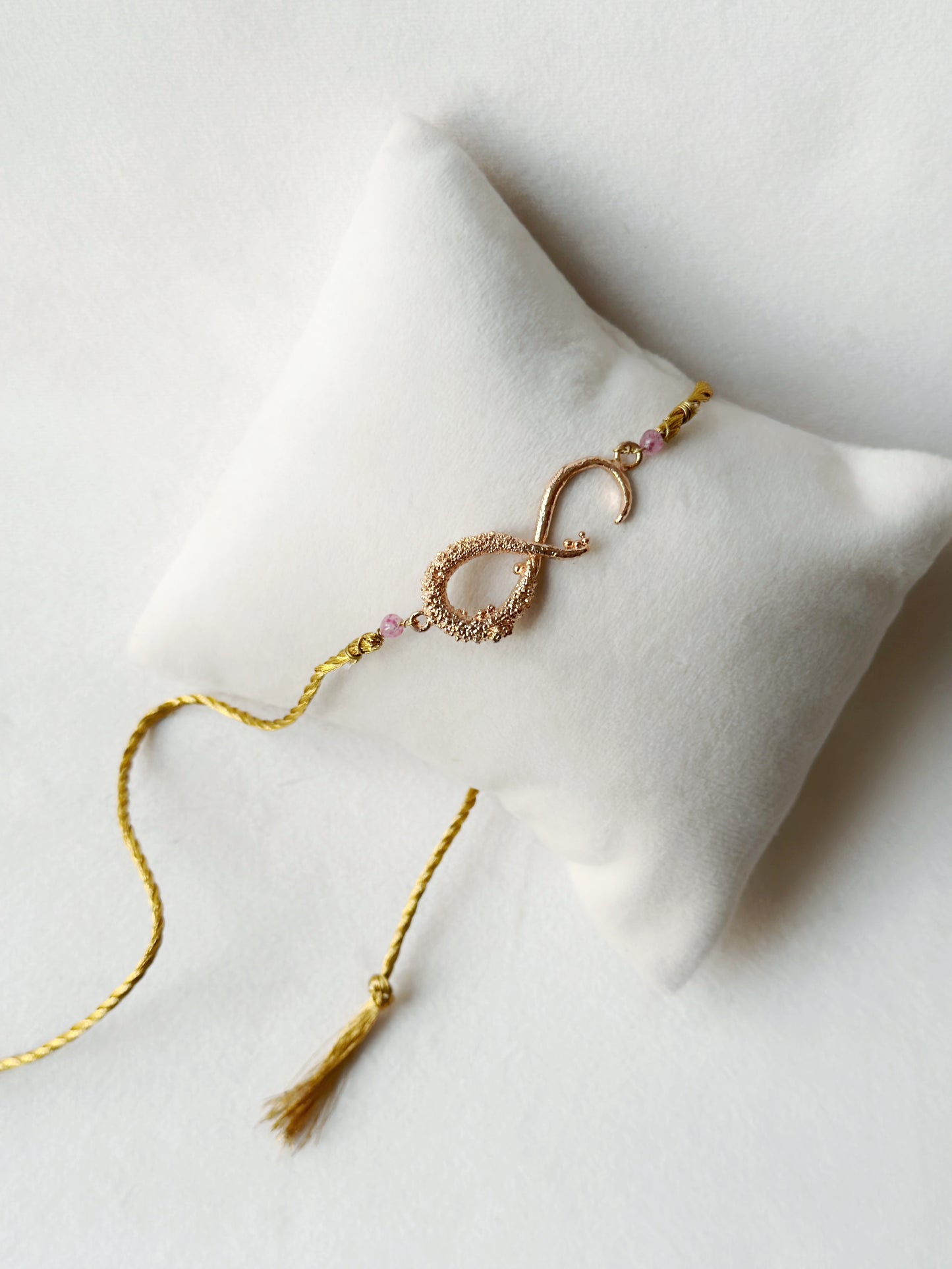 Infinity Rakhi Rose and Gold