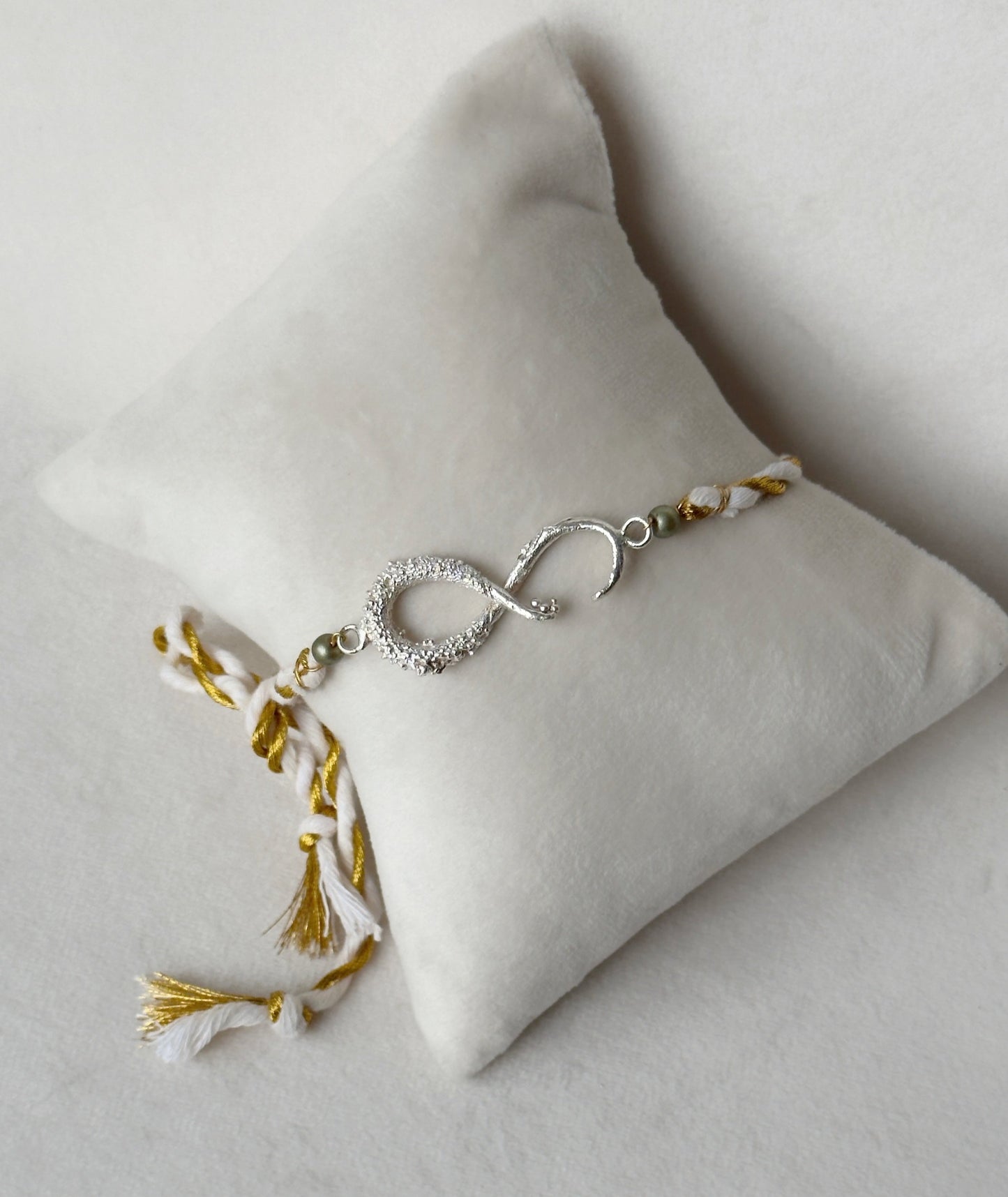 Infinity Rakhi Silver and White