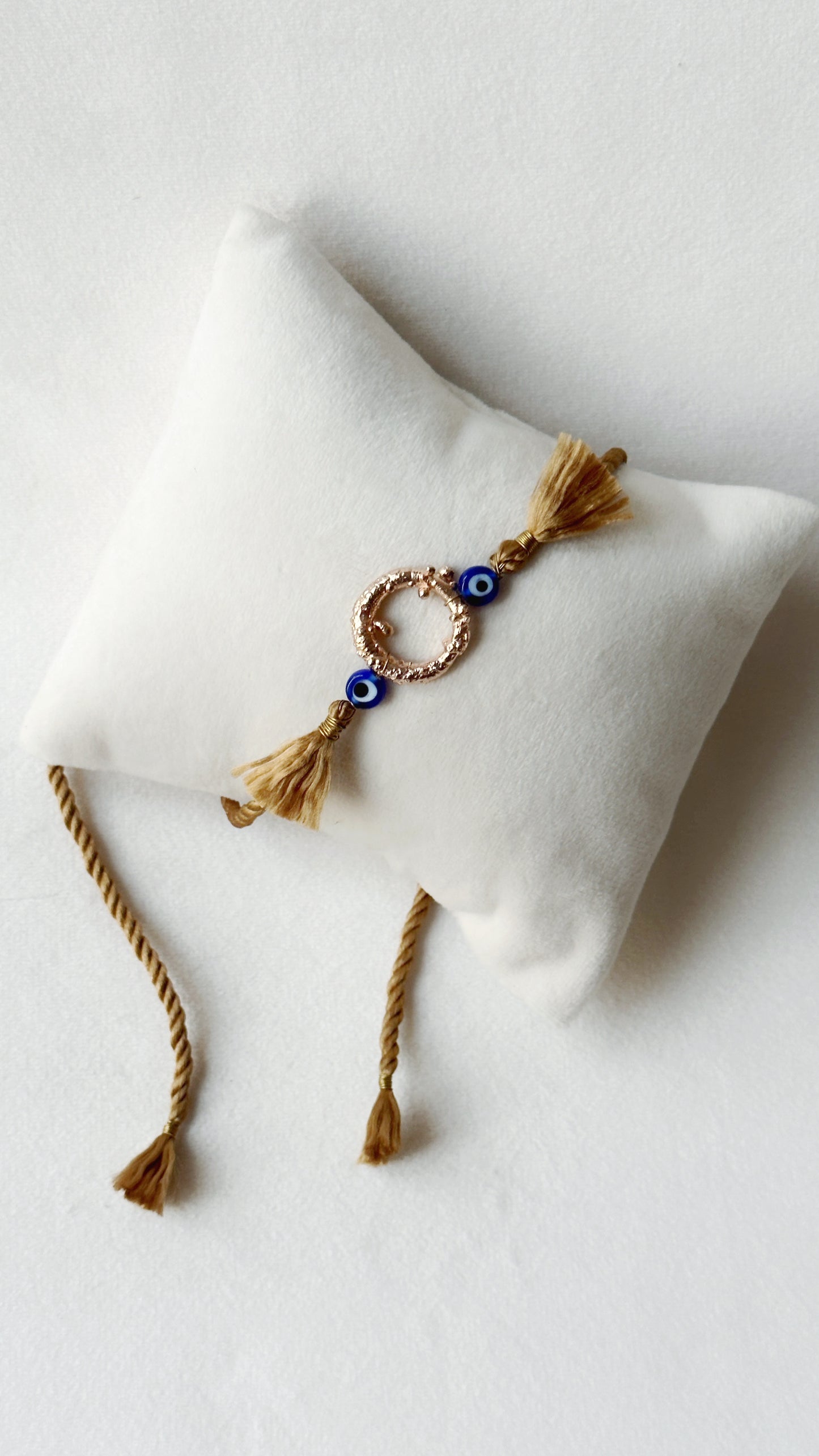 Mudra Rakhi Rose Gold and Gold thread