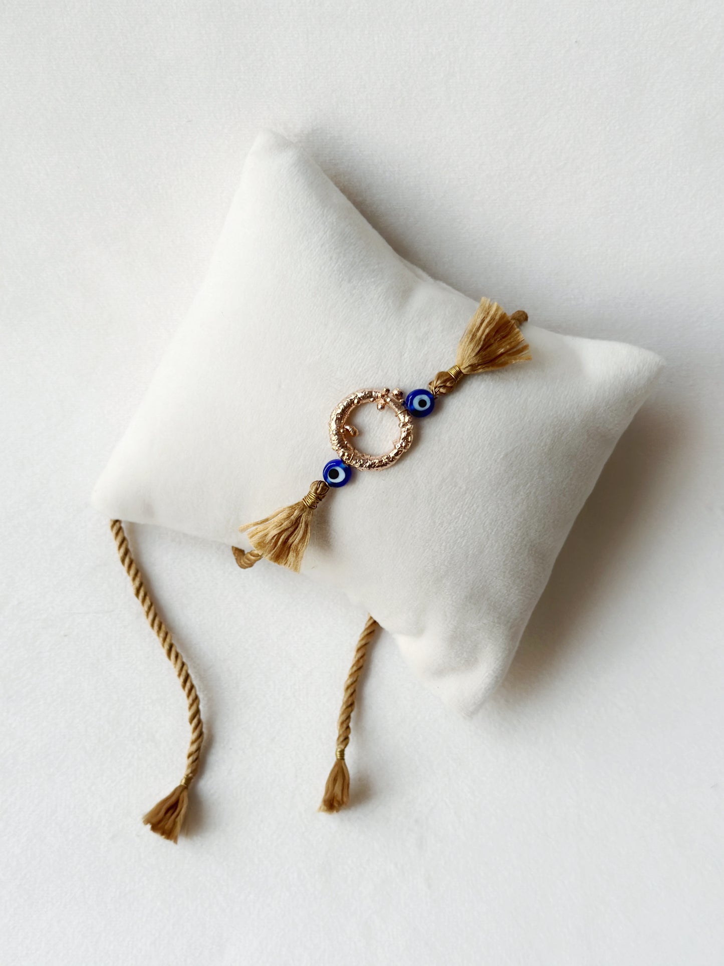 Mudra Rakhi Rose Gold and Gold thread