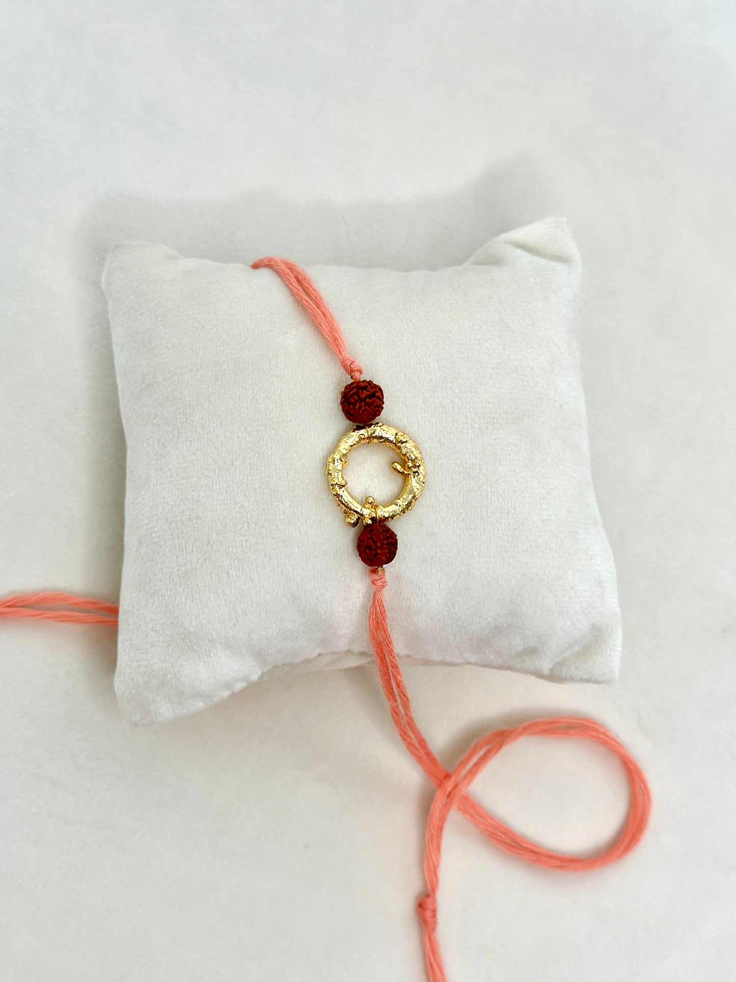 Mudra Rakhi Gold Rudraksh Pink Thread