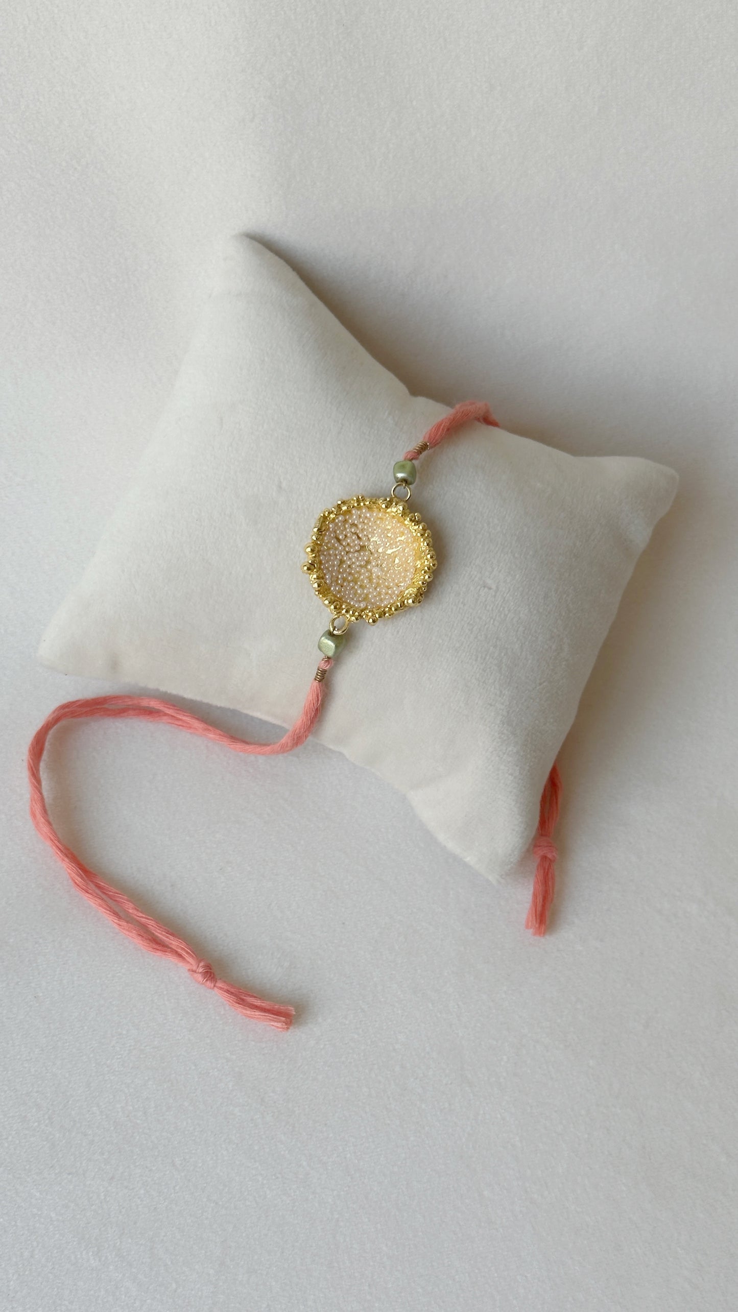 Surya Rakhi Gold and Pink