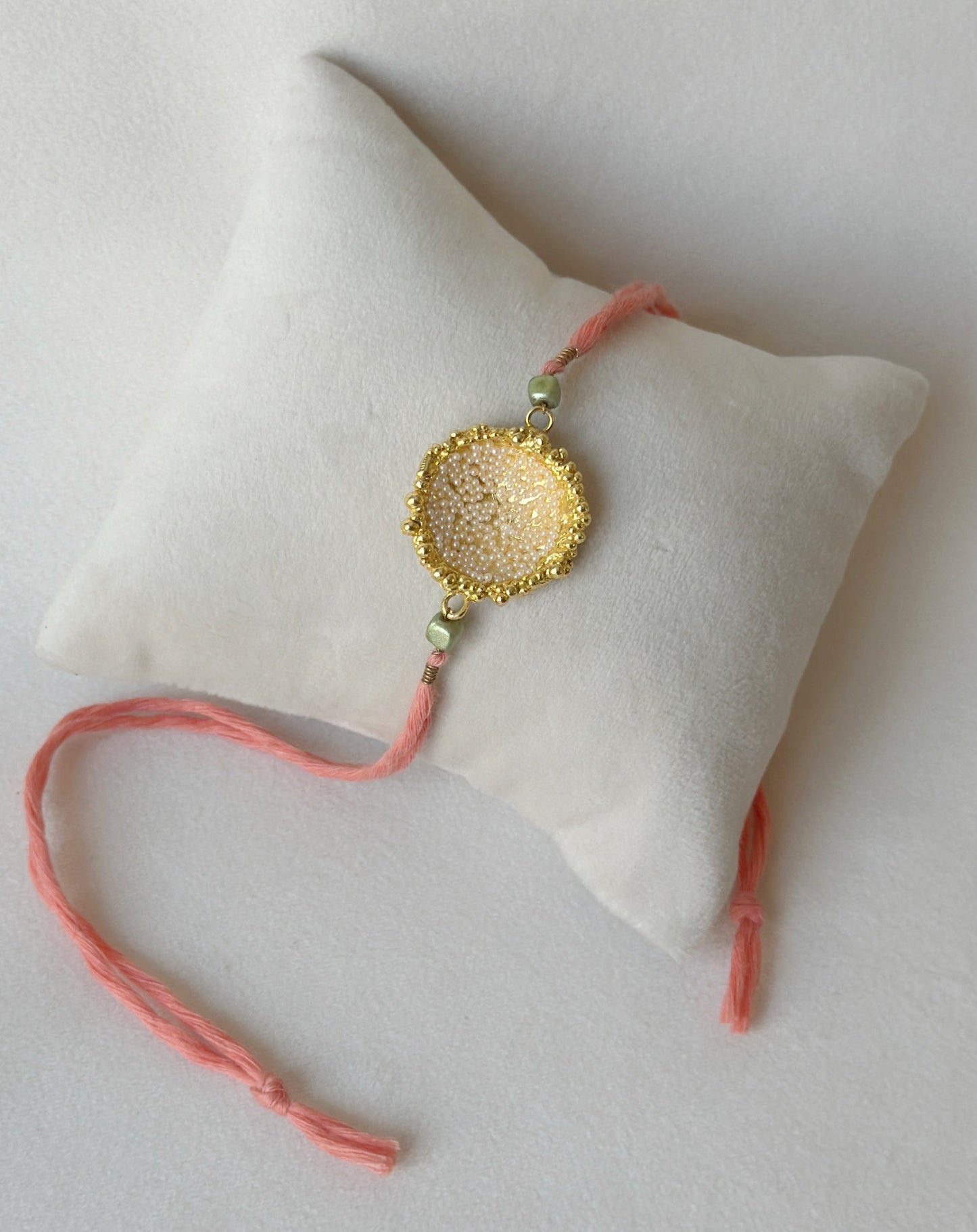 Surya Rakhi Gold and Pink