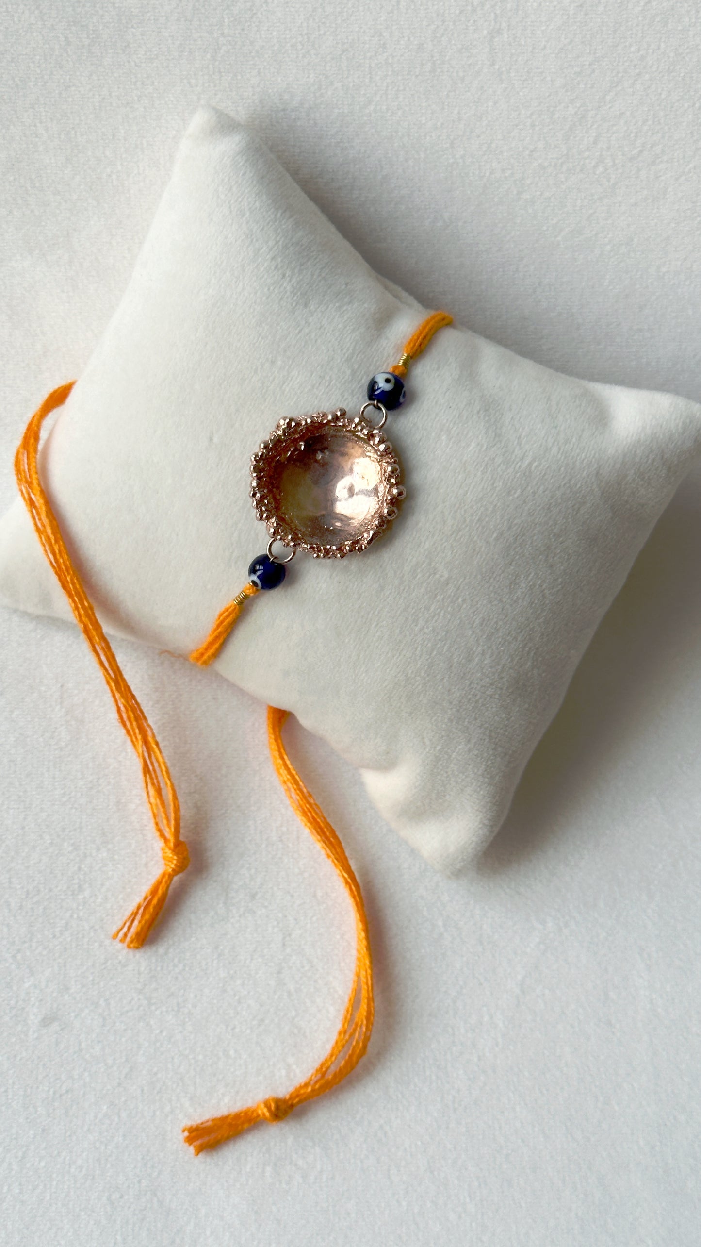 Surya Rakhi Rose Gold and Saffron