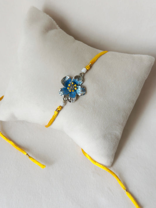 Floral Rakhi Small Silver and saffron