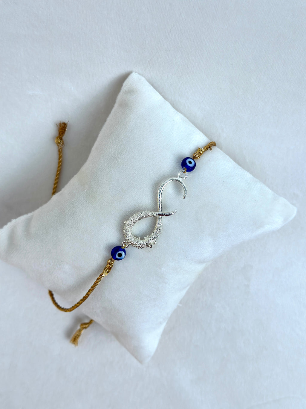 Infinity Rakhi Silver and Gold