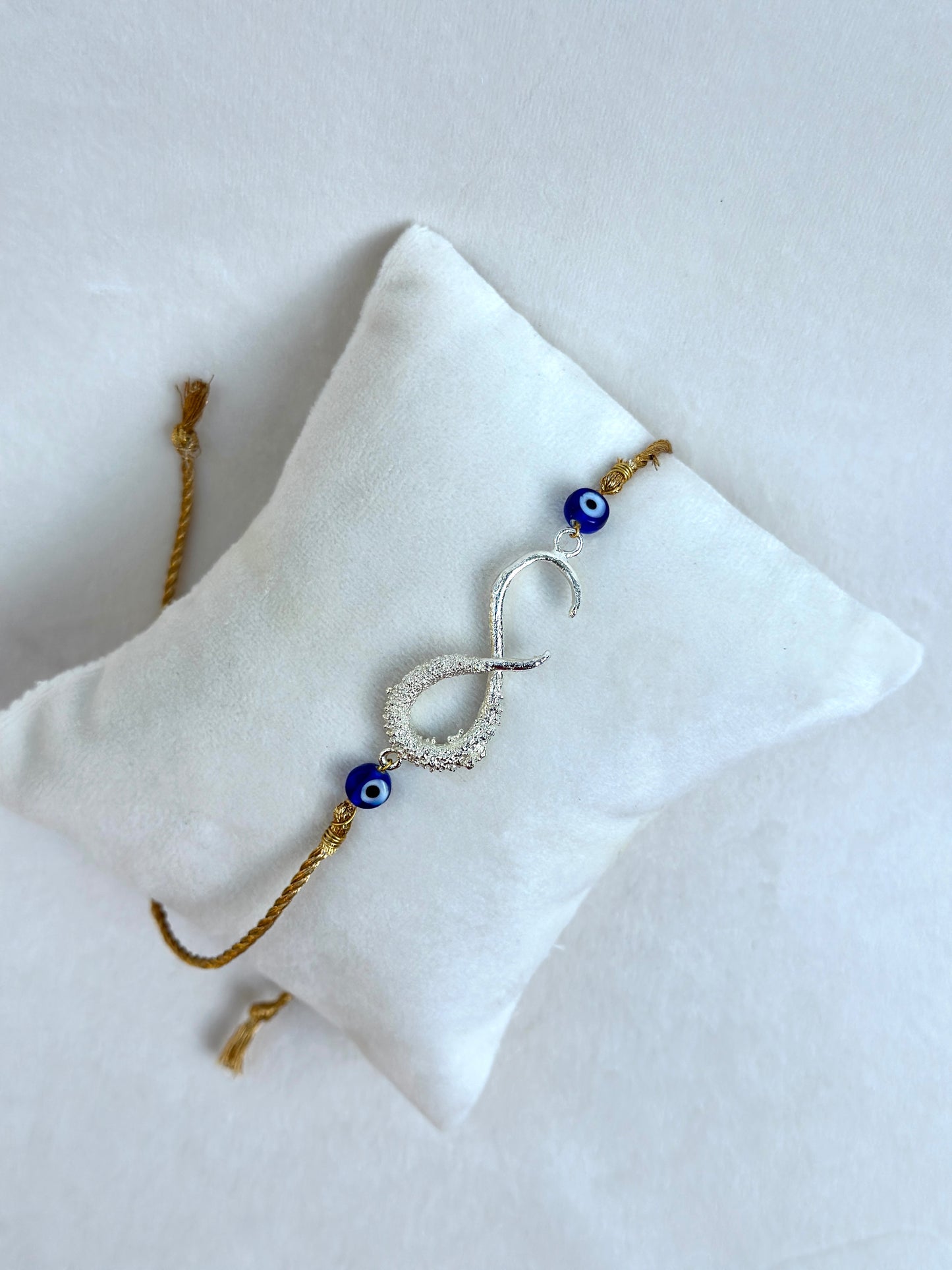Infinity Rakhi Silver and Gold
