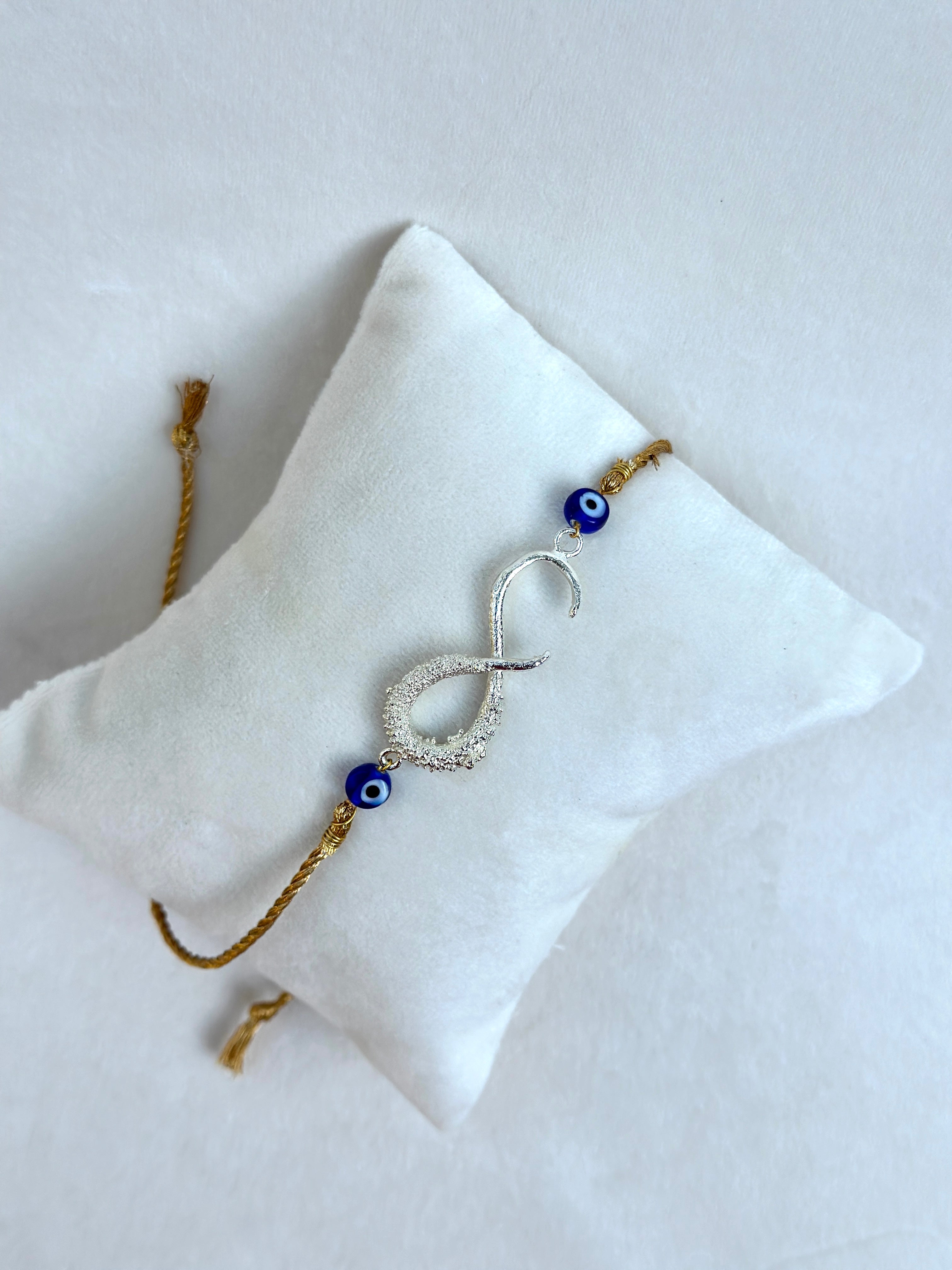 Infinity Rakhi Silver and Gold