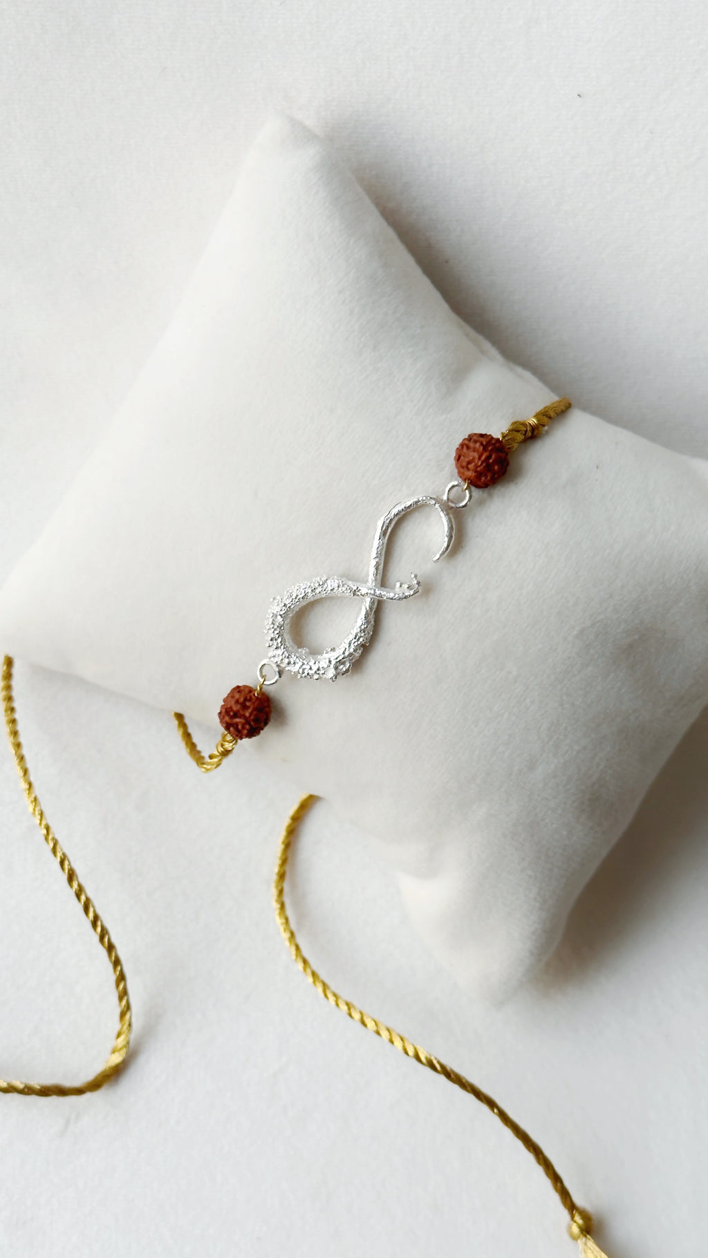 Infinity Rakhi Silver and Gold with Rudraksh beads