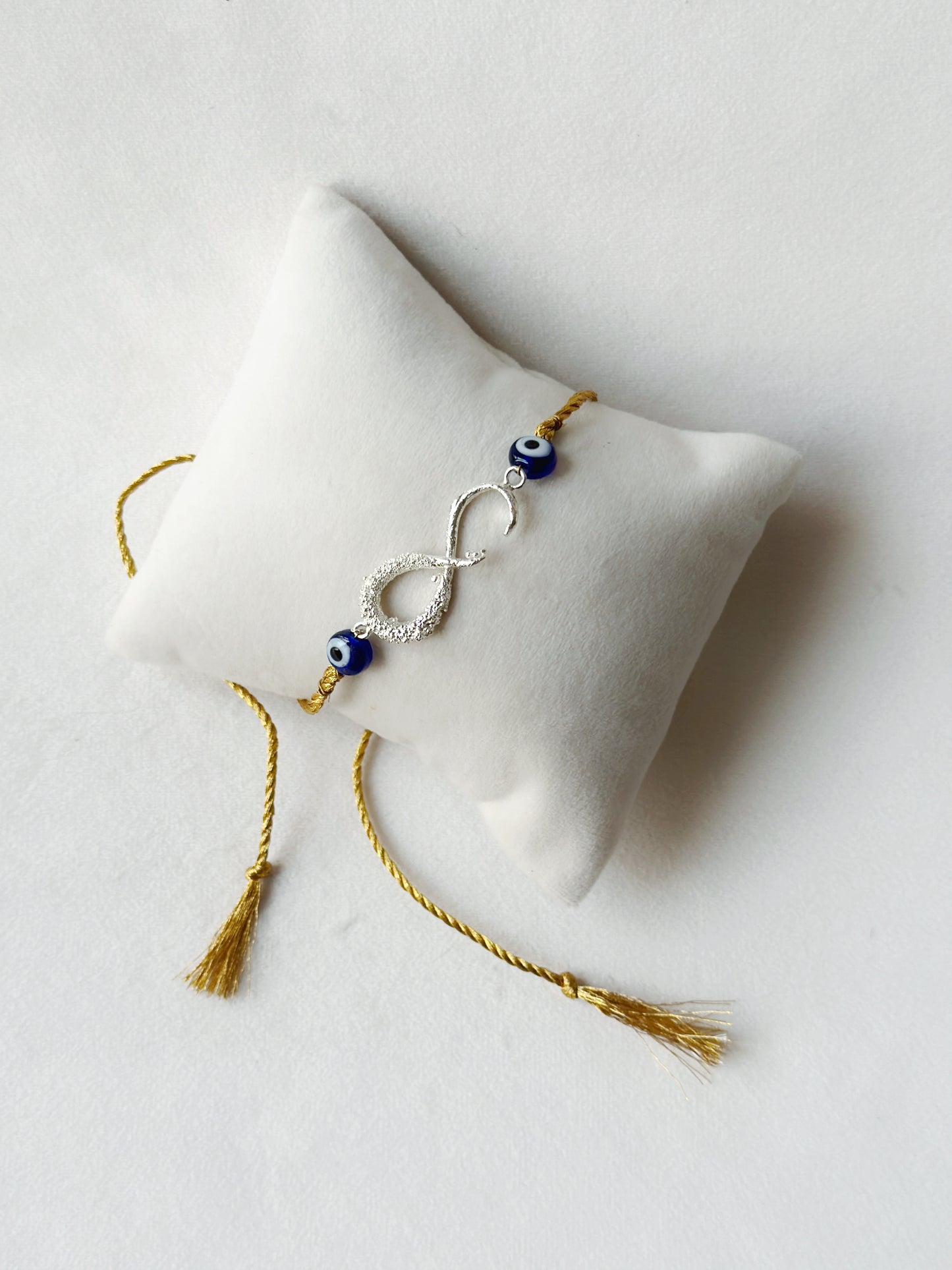 Infinity Rakhi Silver and Gold
