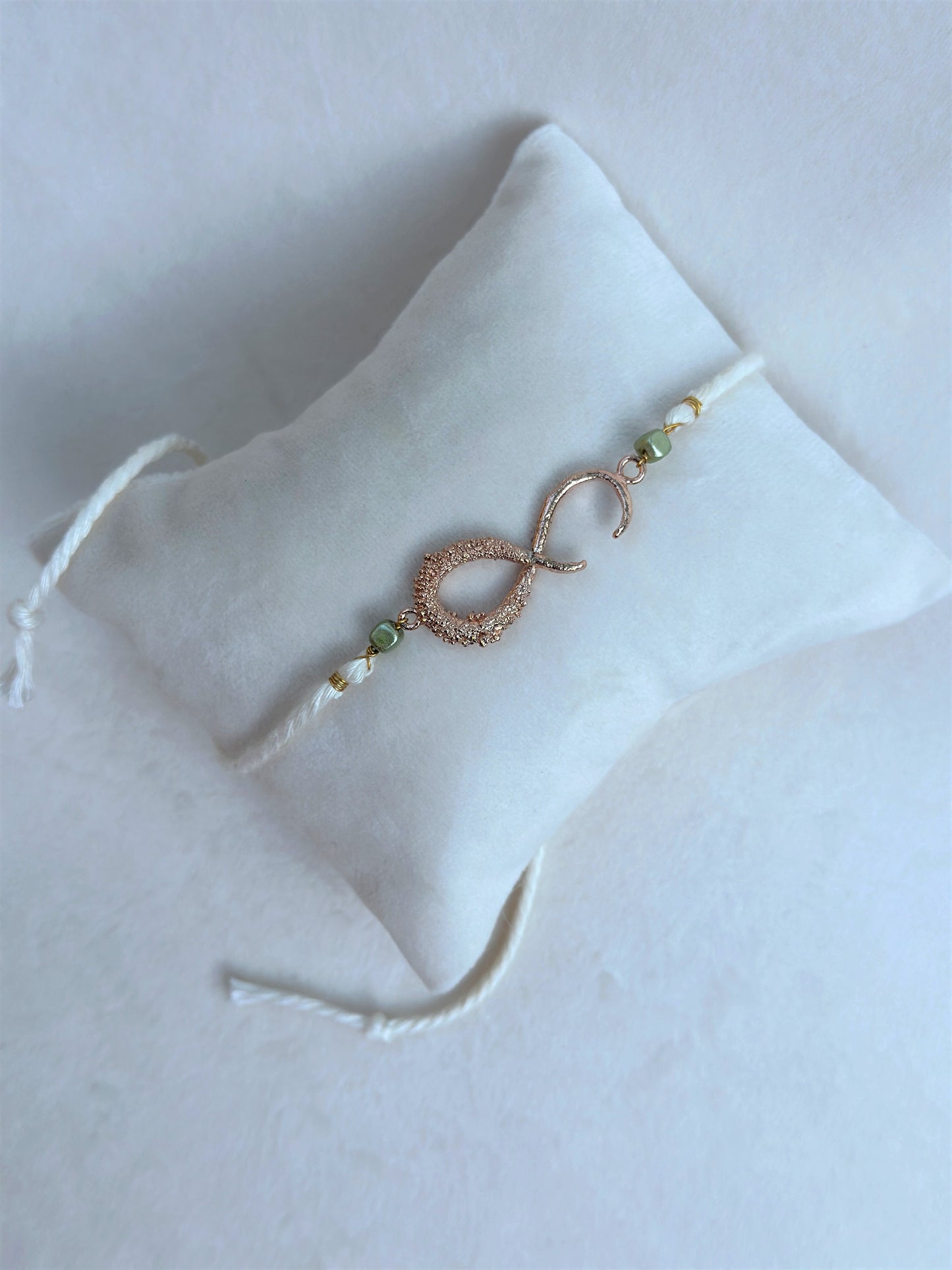 Infinity Rakhi Rose and White