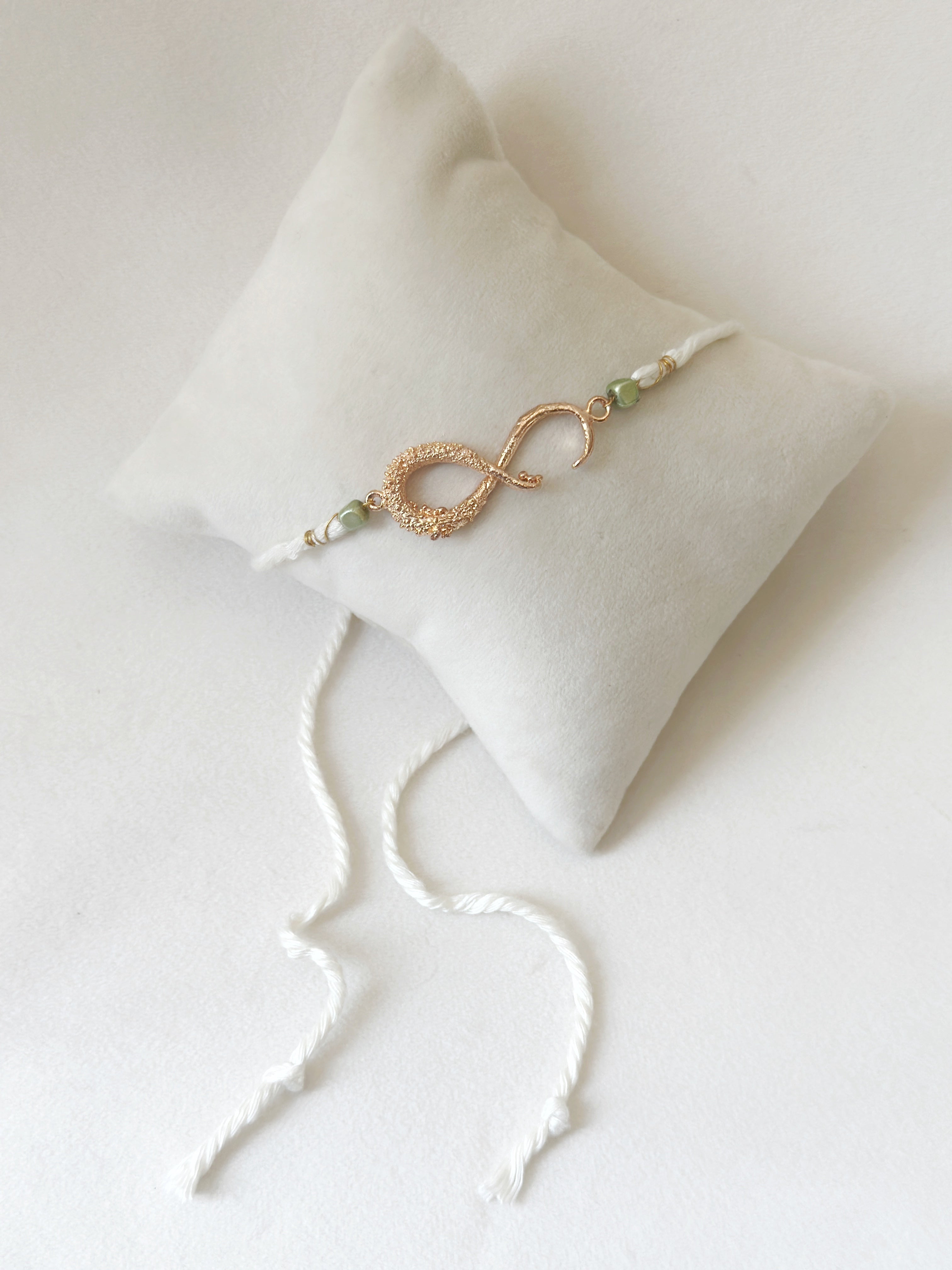 Infinity Rakhi Rose and White