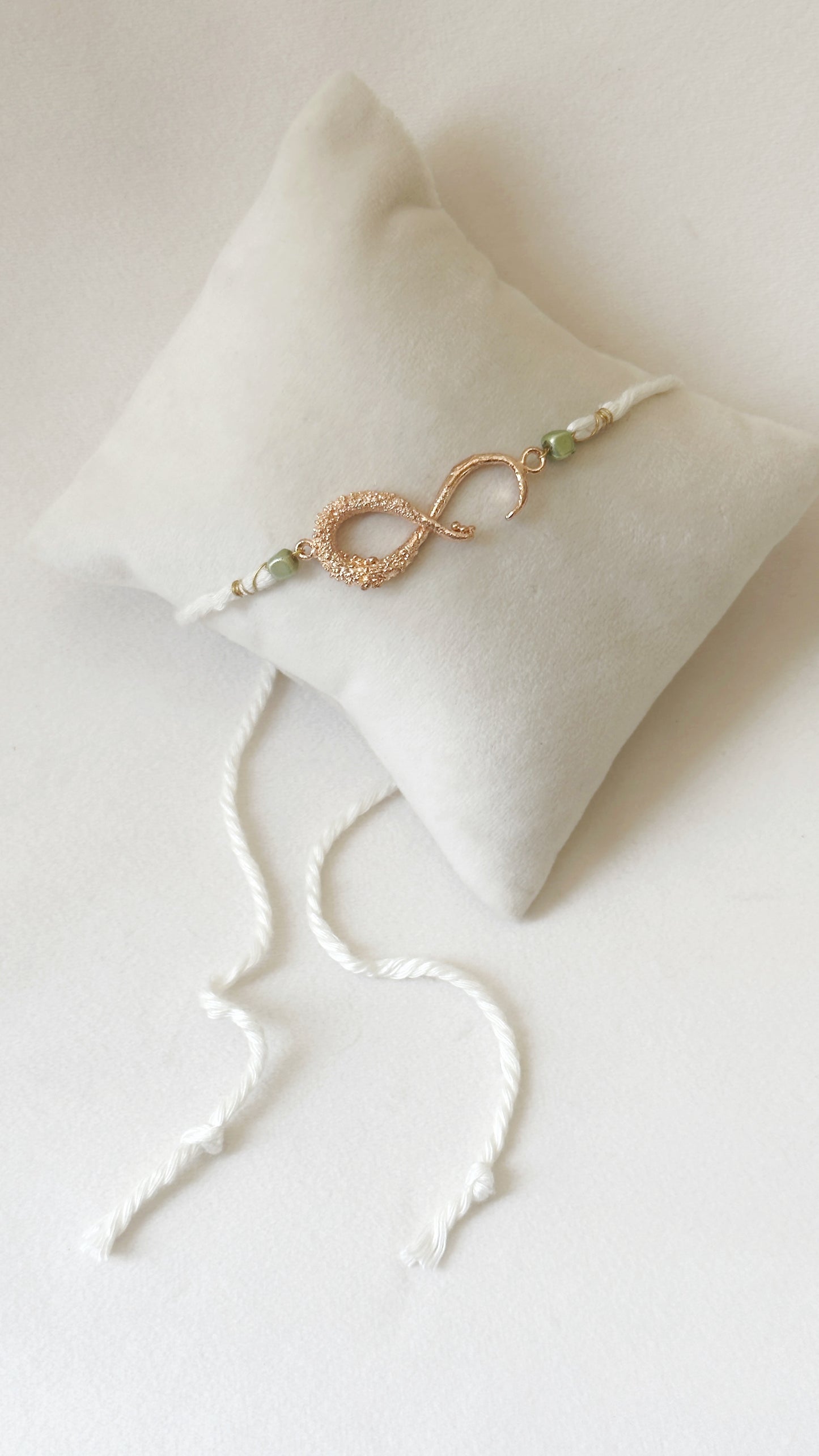 Infinity Rakhi Rose and White