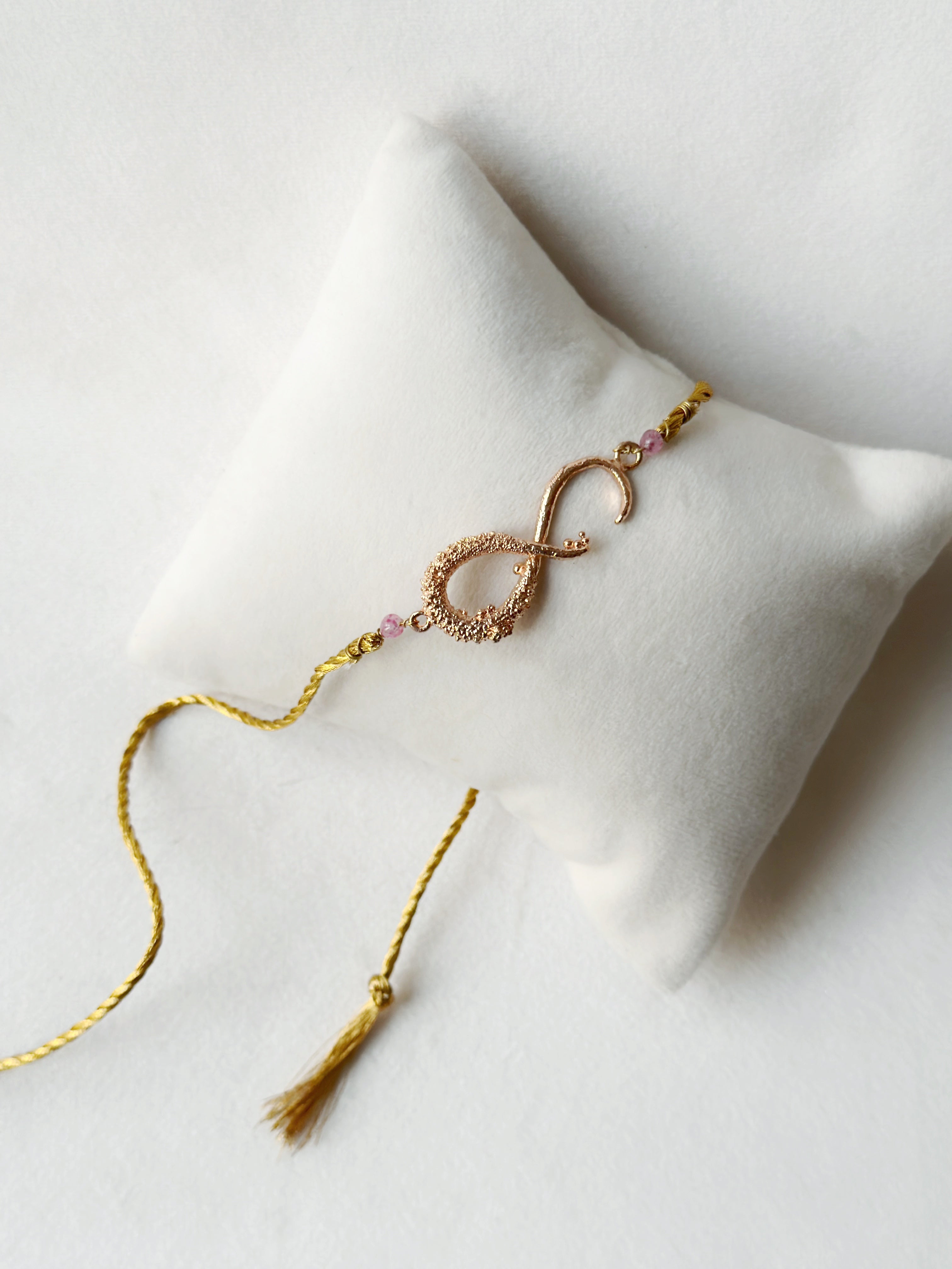 Infinity Rakhi Rose and Gold