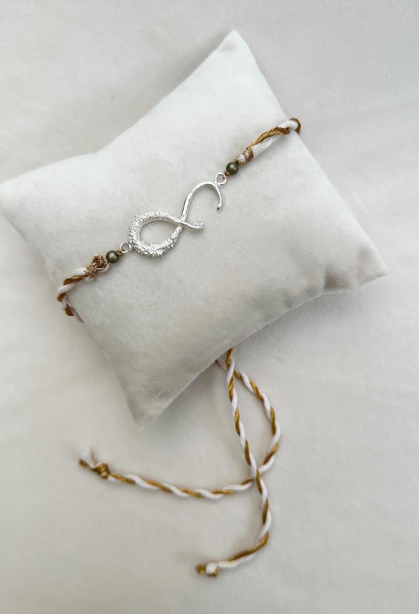 Infinity Rakhi Silver and White