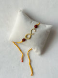 Infinity Rakhi Gold and Saffron with Rudraksh beads