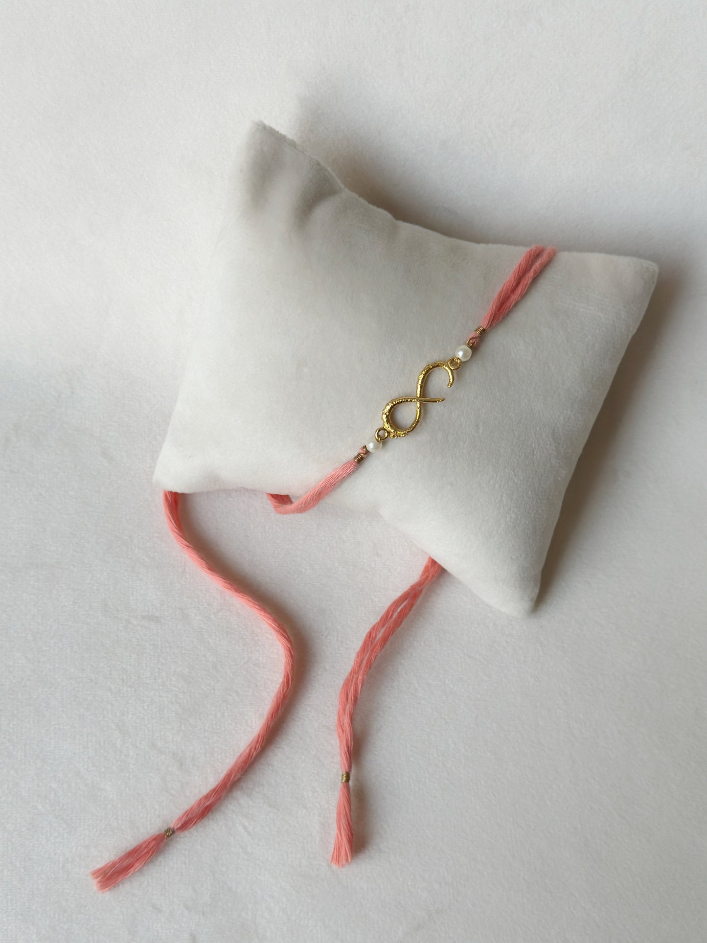 Small Infinity Rakhi Gold and Pink with Pearls
