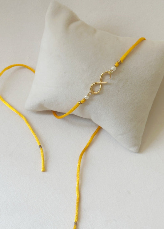 Small Infinity Rakhi Gold and Saffron with Pearls
