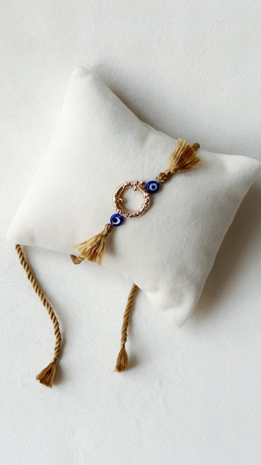 Mudra Rakhi Rose Gold and Gold thread