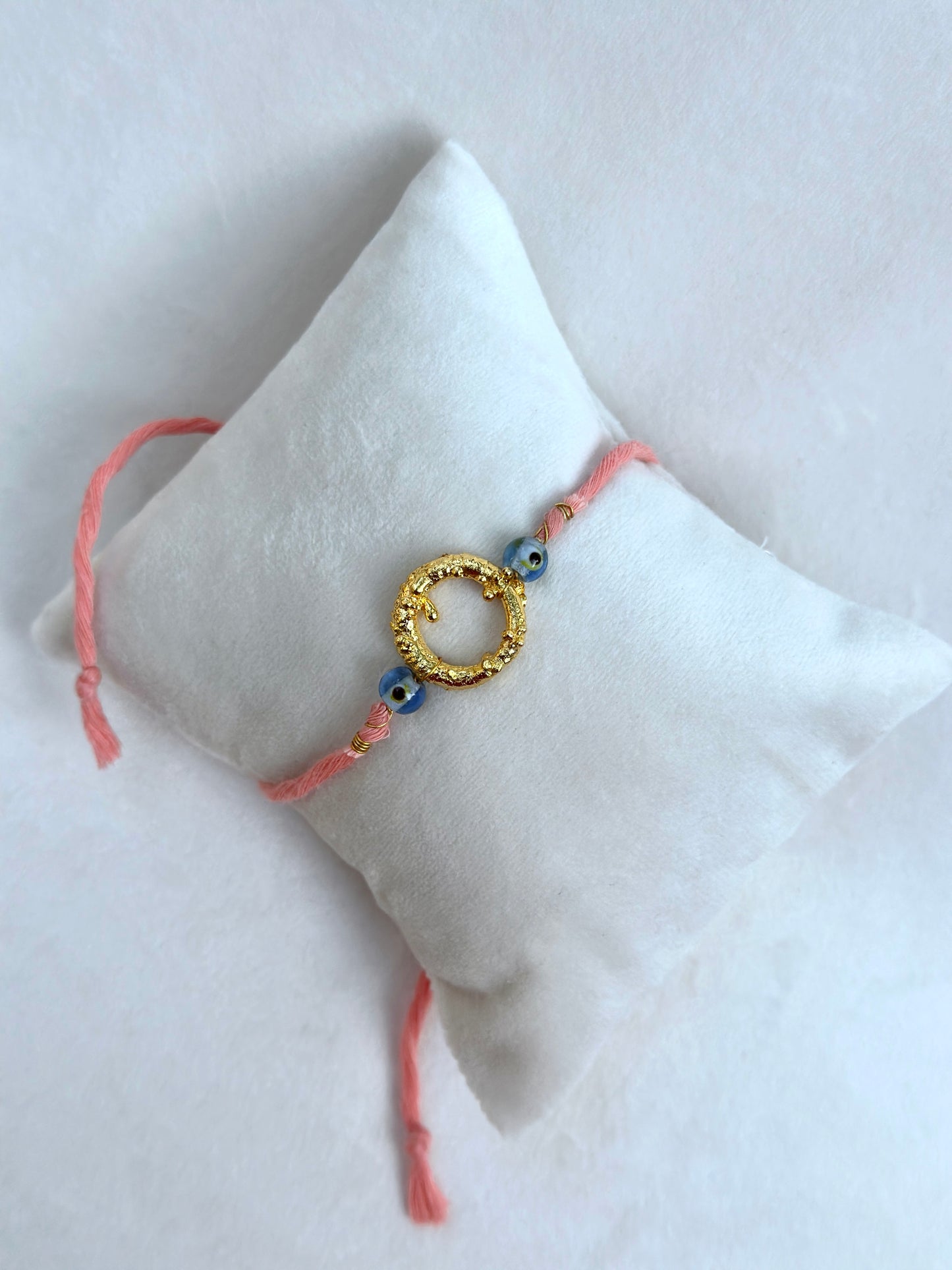 Mudra Rakhi Gold and Pink