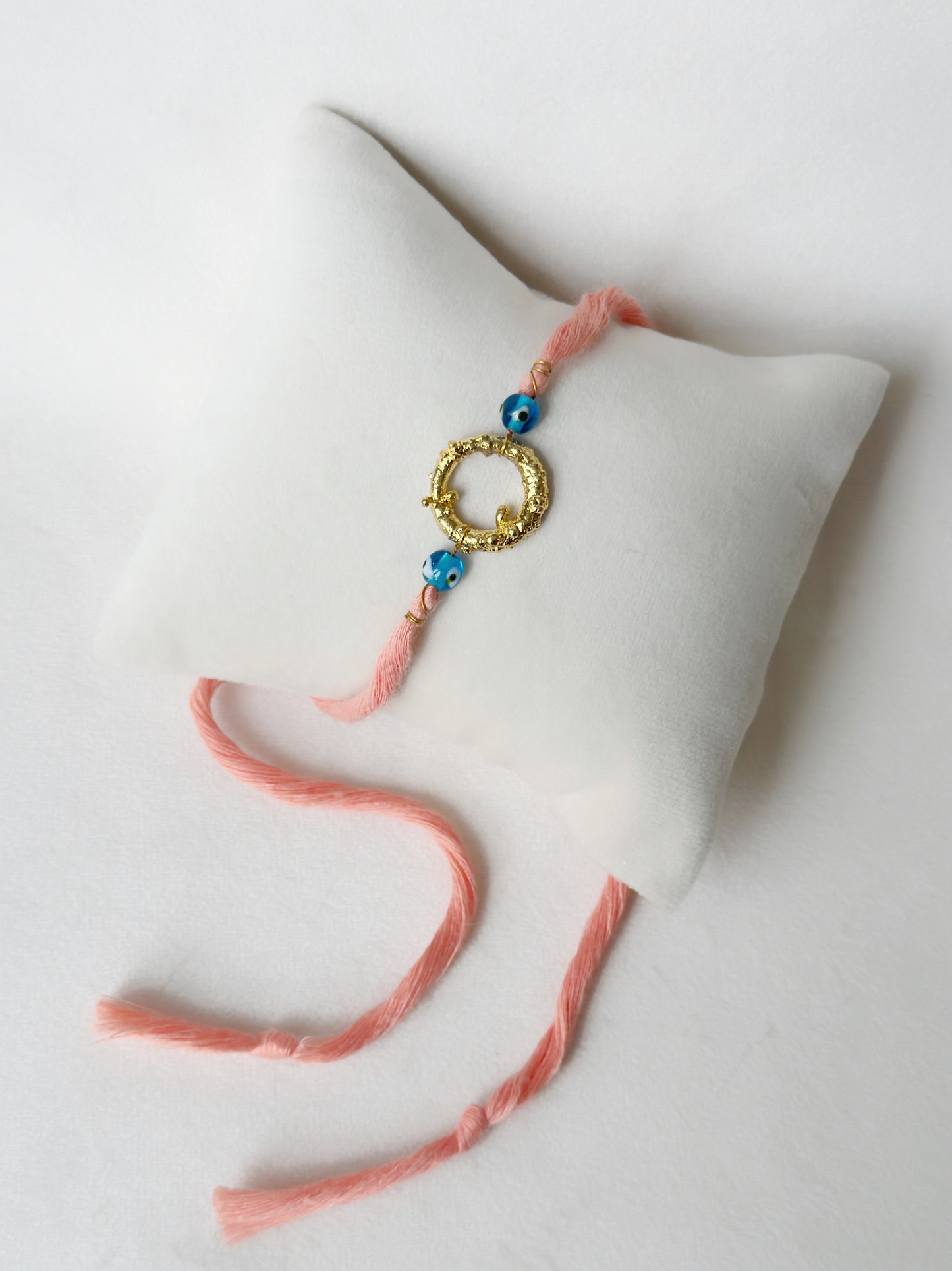 Mudra Rakhi Gold and Pink