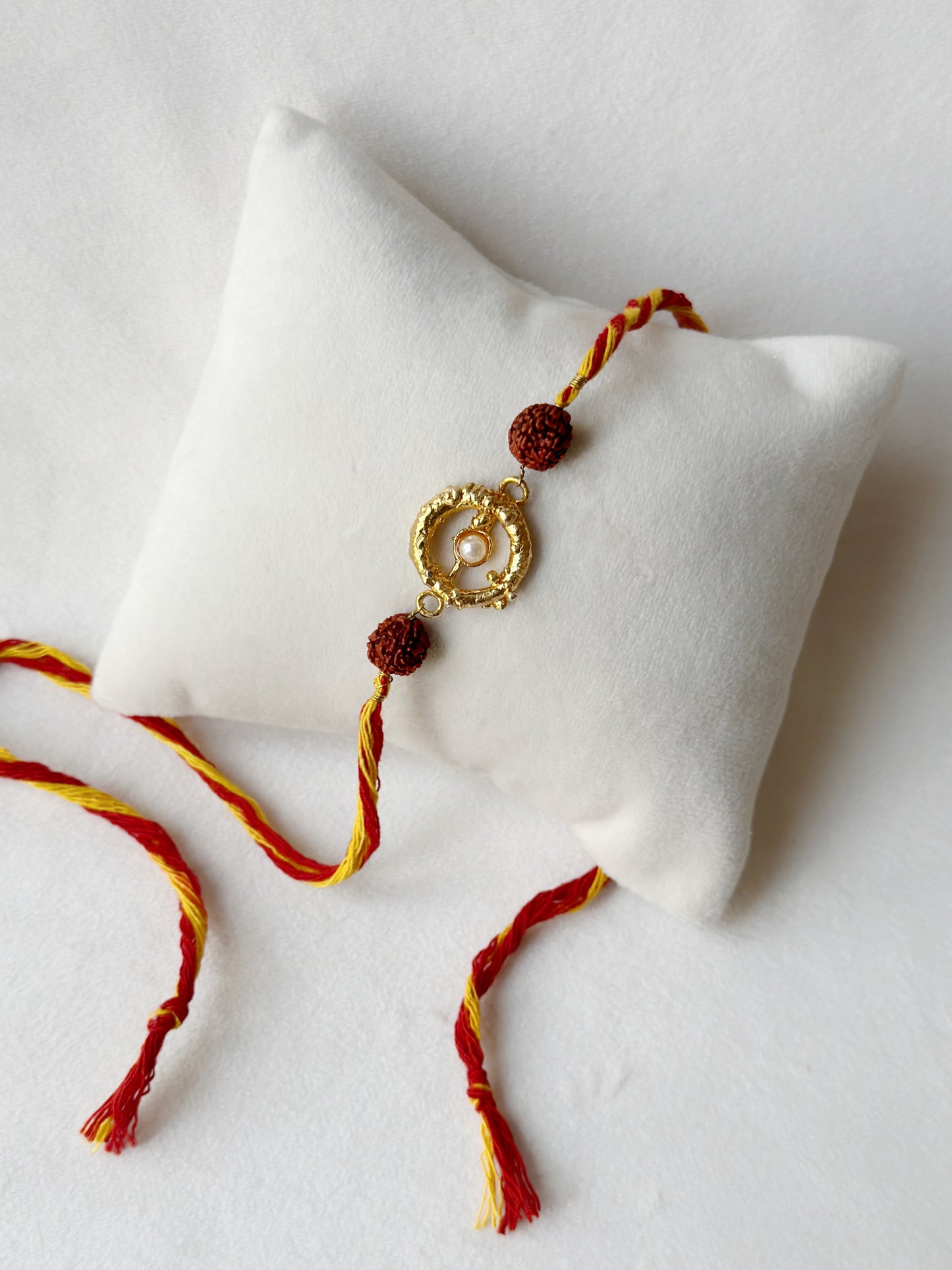 Mudra Stone Rakhi Gold and Red Rudraksh