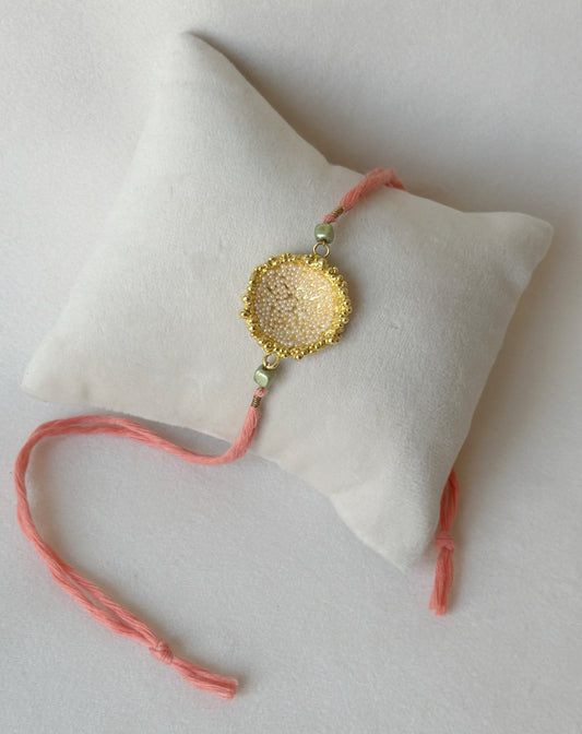Surya Rakhi Gold and Pink