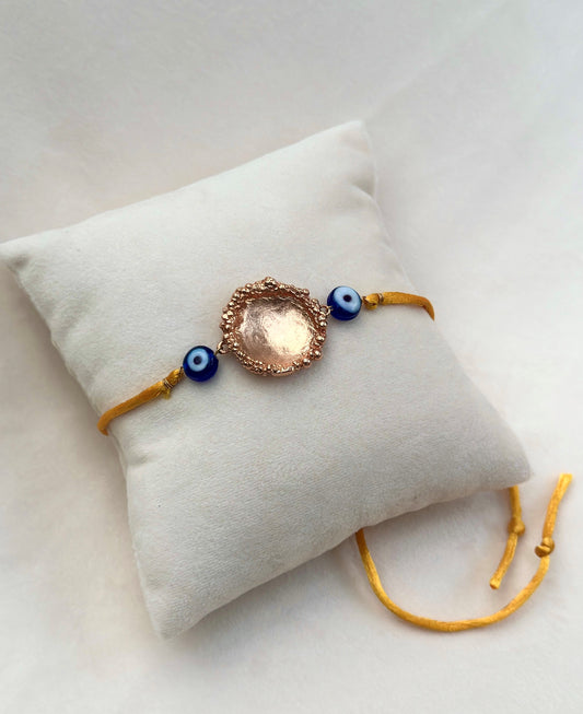 Surya Rakhi Rose Gold and Saffron