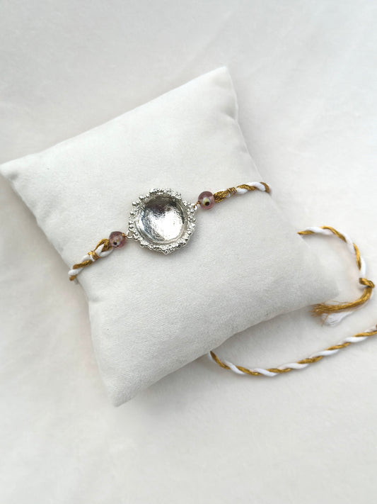 Surya Rakhi Silver and White gold