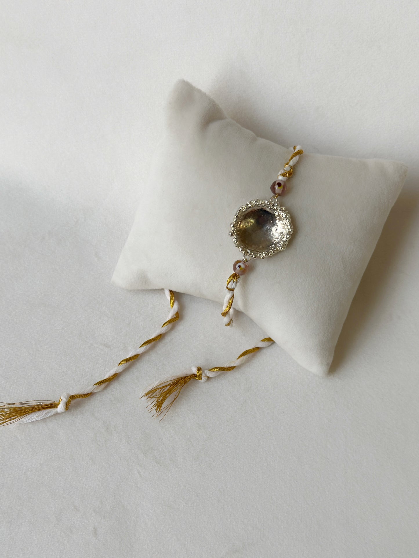 Surya Rakhi Silver and White gold