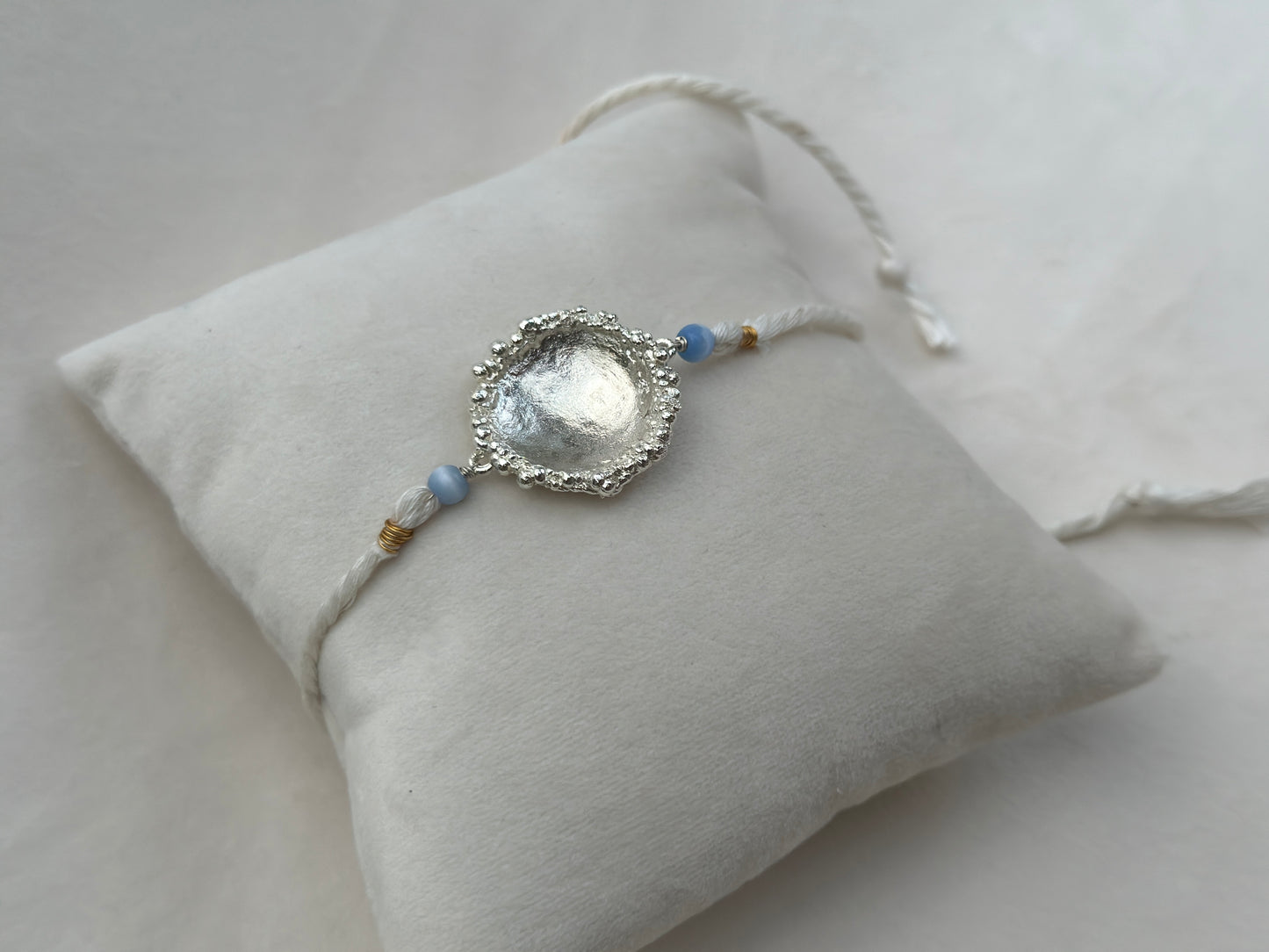 Surya Rakhi Silver and White