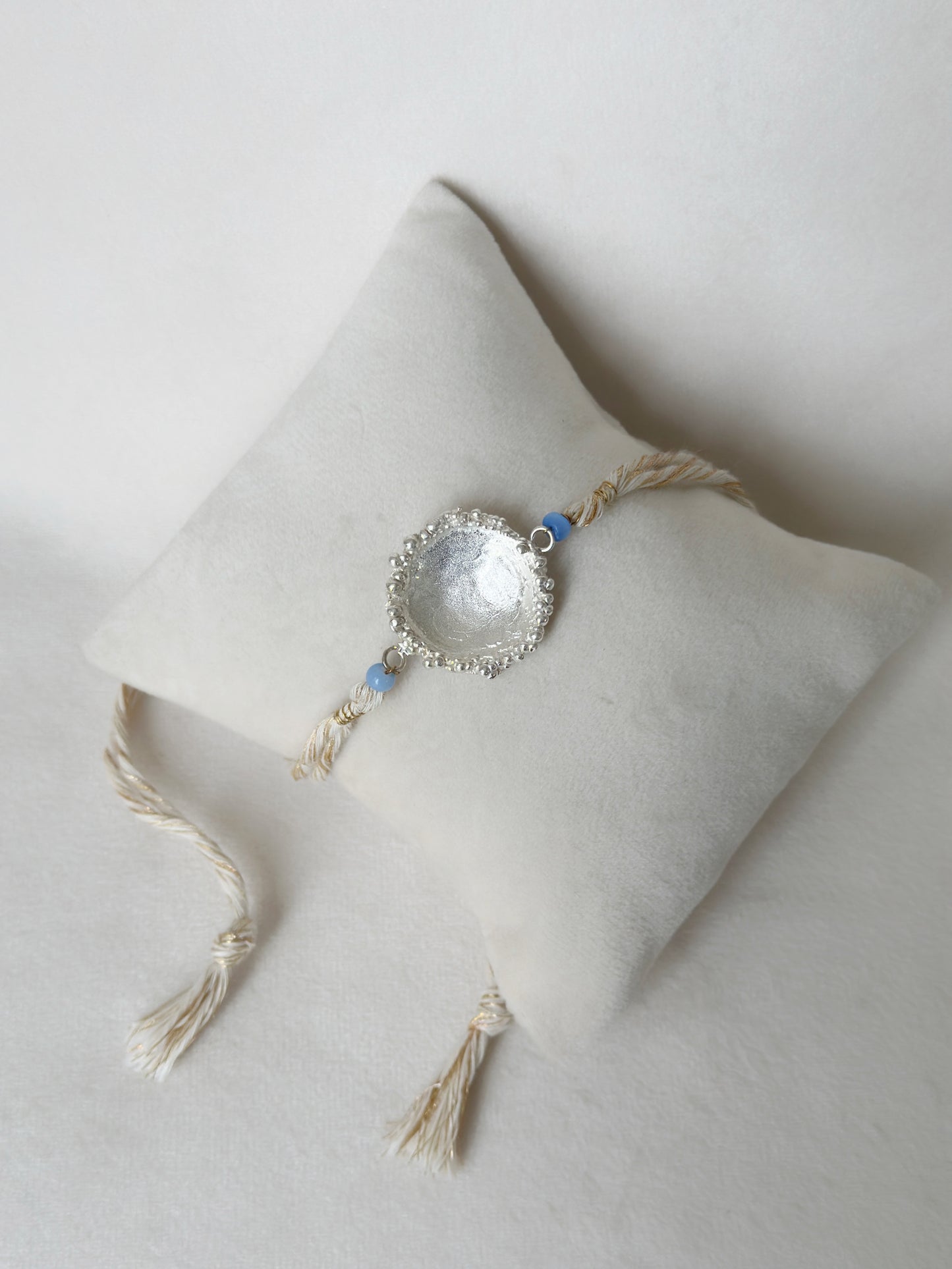 Surya Rakhi Silver and White