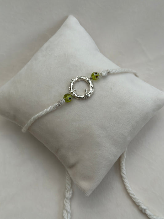 Mudra Rakhi Silver and White