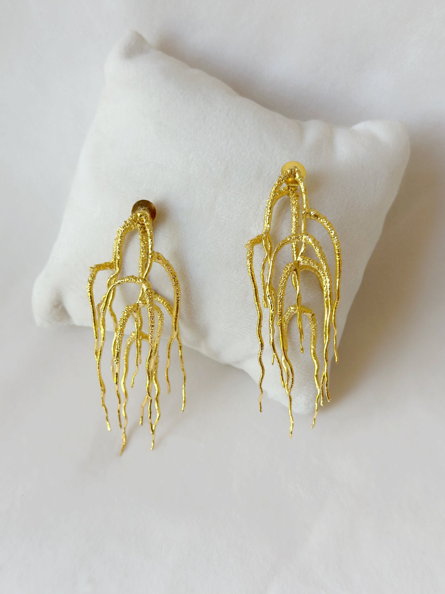 Untamed goddess dangles gold