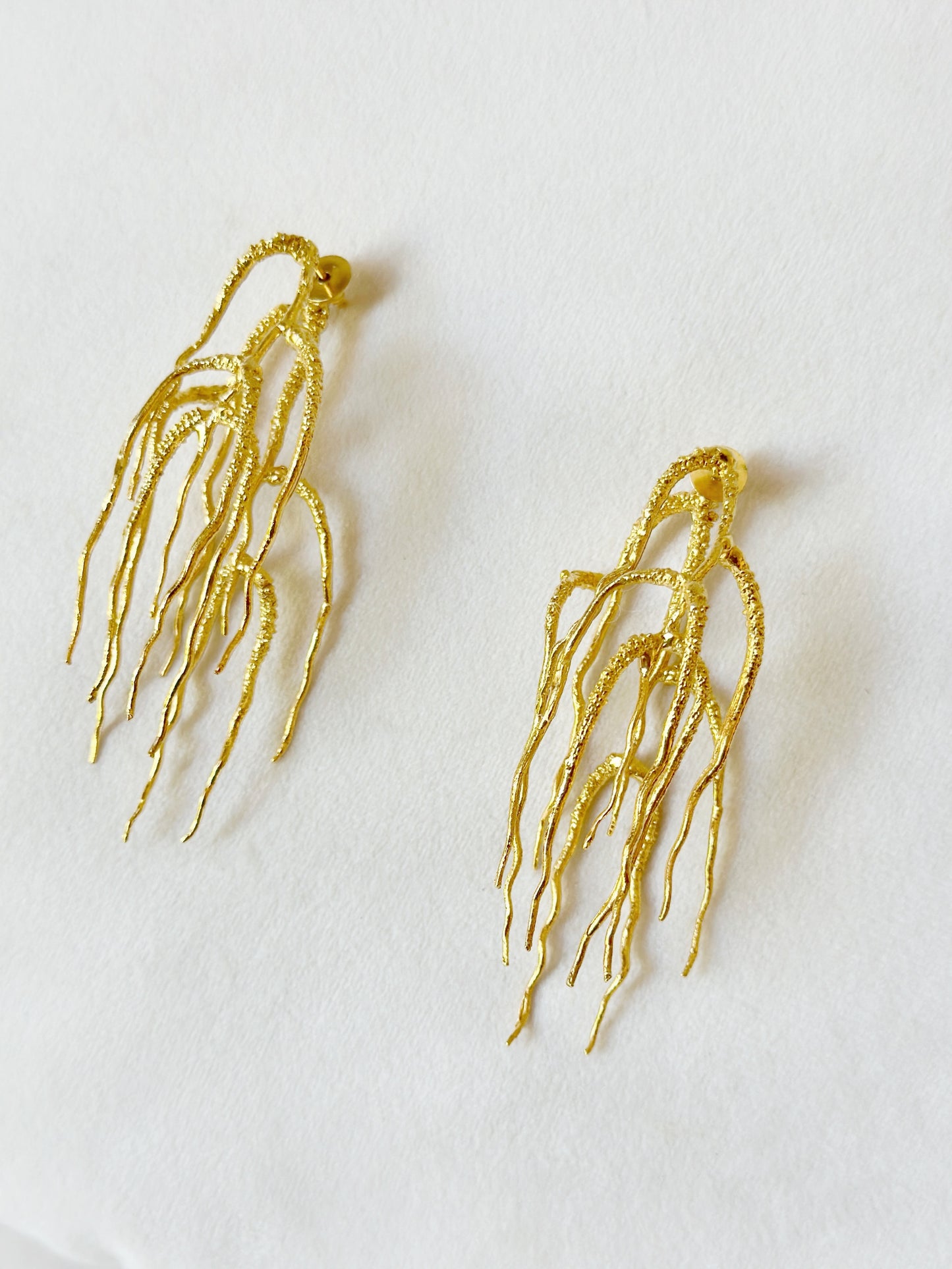 Untamed goddess dangles gold