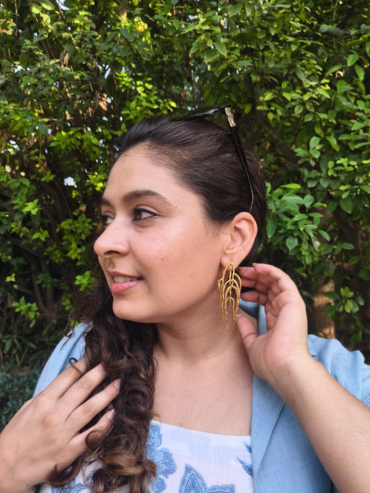 Untamed goddess dangles gold